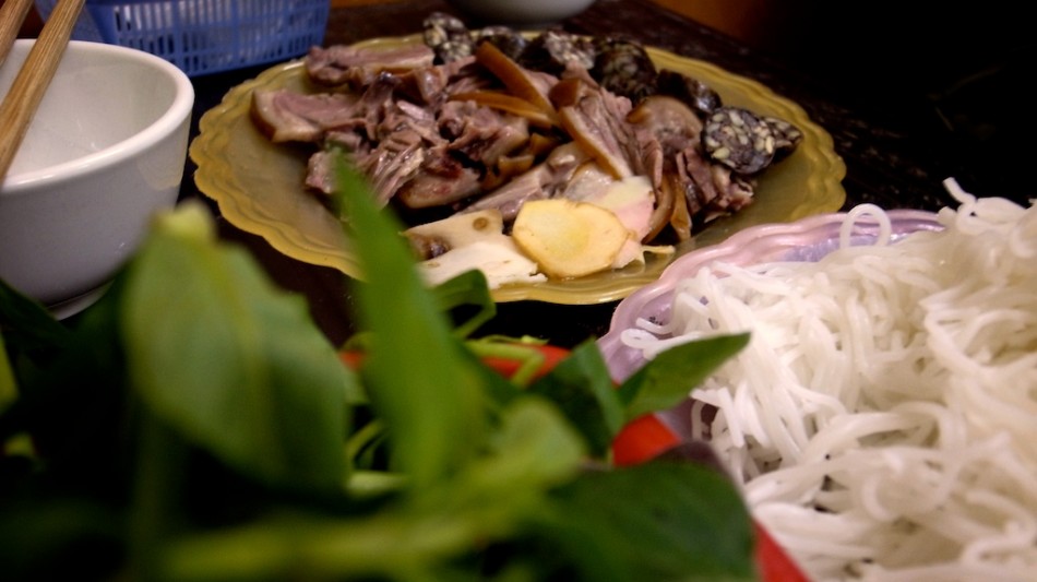 eating a dog meat meal in Hanoi, Vietnam